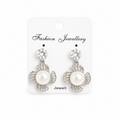 Elegant earrings on white